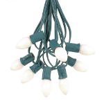 100 C7 String Light Set with White Ceramic Bulbs on Green Wire