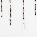 Frosted Orange 100 Light Icicle Lights Black Wire Medium Drops