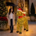Standing illuminated holiday deer in an upscale outdoor plaza