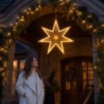 Gold seven-point star suspended at a luxury residential entrance