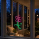 Pink LED rope light flower displayed in a residential window