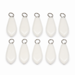 Ten white teardrop-shaped light string weights laid out in two rows