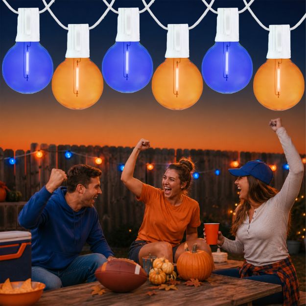 Blue and Orange LED filament G40 globe string lights glowing over an outdoor game day gathering