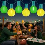 Green and Yellow LED filament G40 globe string lights glowing over an outdoor game day gathering