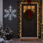 36" Deluxe LED Snowflake Pure White lit and mounted beside a front door on a snowy evening