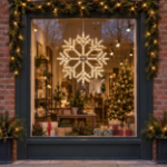 24" Fancy LED Snowflake Warm White lit and mounted displayed in a lit, decorated storefront window