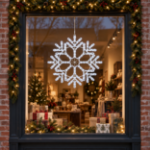 24" Fancy LED Snowflake Pure White lit and mounted displayed in a lit, decorated storefront window