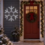 36" Traditional LED Snowflake Pure White lit and mounted beside a front door on a snowy evening