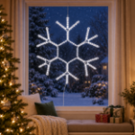 36" Traditional LED Snowflake Pure White lit and mounted hanging in a holiday-decorated window at night