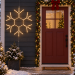 36" Traditional LED Snowflake Warm White lit and mounted beside a front door on a snowy evening