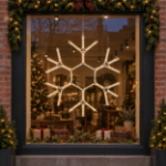 36" Traditional LED Snowflake Warm White lit and mounted displayed in a lit, decorated storefront window