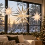 Holiday living room with lit Moravian stars above the mantel