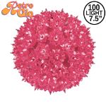 Lit pink RetroGlo starlight sphere, 7.5 inch, shown against white