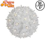 Lit clear RetroGlo starlight sphere, 6 inch, shown against white