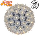 Lit silver RetroGlo starlight sphere, 7.5 inch, shown against white