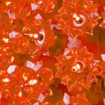 Close view of the orange bulbs set into the reflector facets