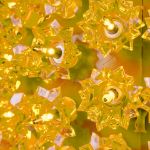 Close view of the yellow bulbs set into the reflector facets