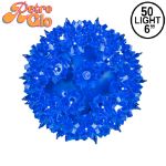 Lit blue RetroGlo starlight sphere, 6 inch, shown against white