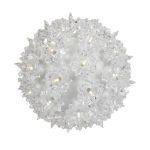 Lit clear twinkling RetroGlo starlight sphere at an angle