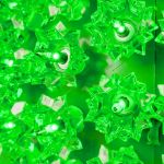 Close view of the green bulbs set into the reflector facets