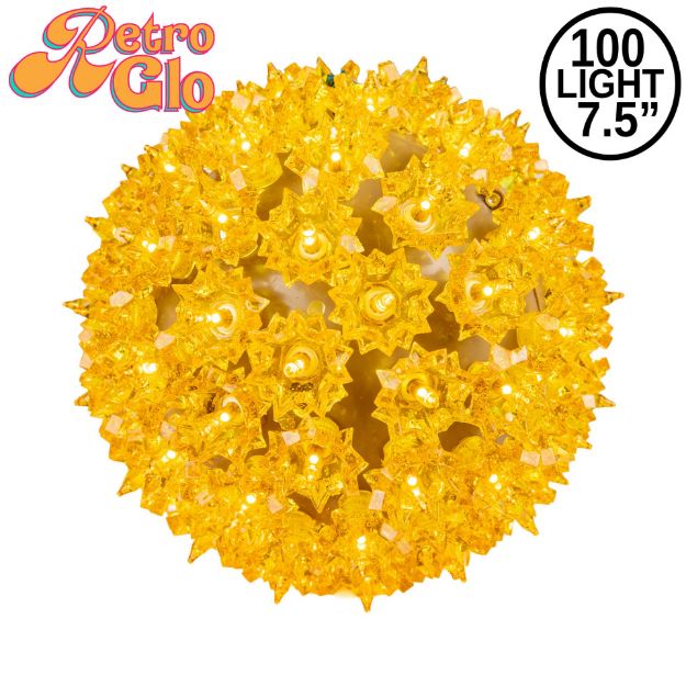 Lit gold RetroGlo starlight sphere, 7.5 inch, shown against white