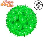 Lit green RetroGlo starlight sphere, 6 inch, shown against white