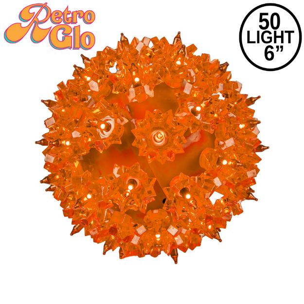 Lit orange RetroGlo starlight sphere, 6 inch, shown against white