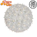 Lit clear RetroGlo starlight sphere, 7.5 inch, shown against white