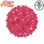 Lit pink RetroGlo starlight sphere, 6 inch, shown against white