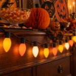 Yellow, orange and white RetroGlo C9 Halloween lights glowing in a decorated Halloween scene