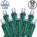 Close-up of pure white 5mm convex LED mini light bulbs on green wire