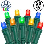 Close-up of multi color 5mm convex LED mini light bulbs on green wire