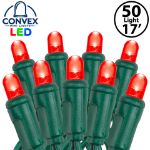 Close-up of red 5mm convex LED mini light bulbs on green wire