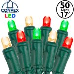 Close-up of red/green/warm white 5mm convex LED mini light bulbs on green wire