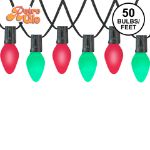 RetroGlo C7 Wicked Witch Halloween light set with lit purple and green ceramic bulbs on black wire
