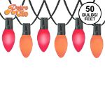 RetroGlo C9 Trick or Treat Halloween light set with lit purple and orange ceramic bulbs on black wire
