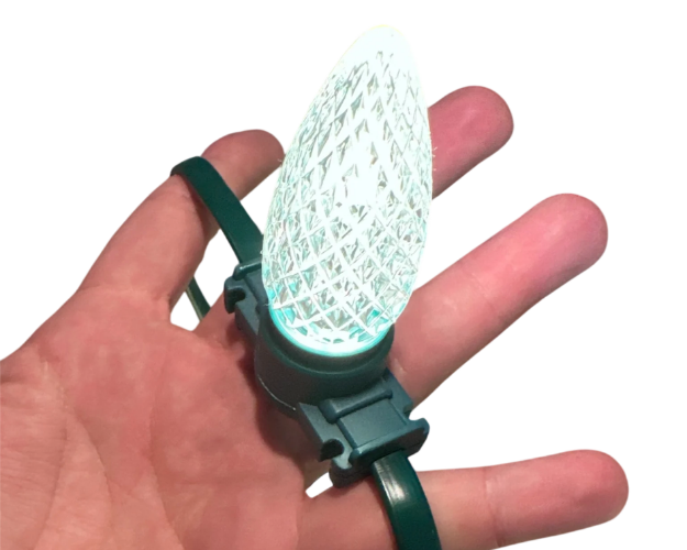 Minleon RGBW+2 C9 faceted bulb on green wire held in hand