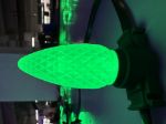 Minleon RGBW C9 faceted bulb lit green