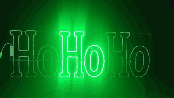 HO HO HO LED neon sign lighting up letter by letter in red, green and white