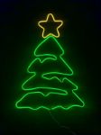 Green Christmas tree LED neon sign lit with a yellow star on top